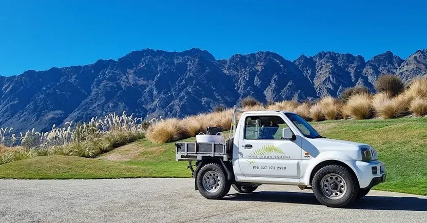 Company truck parked with the Remarkables mountain backdrop